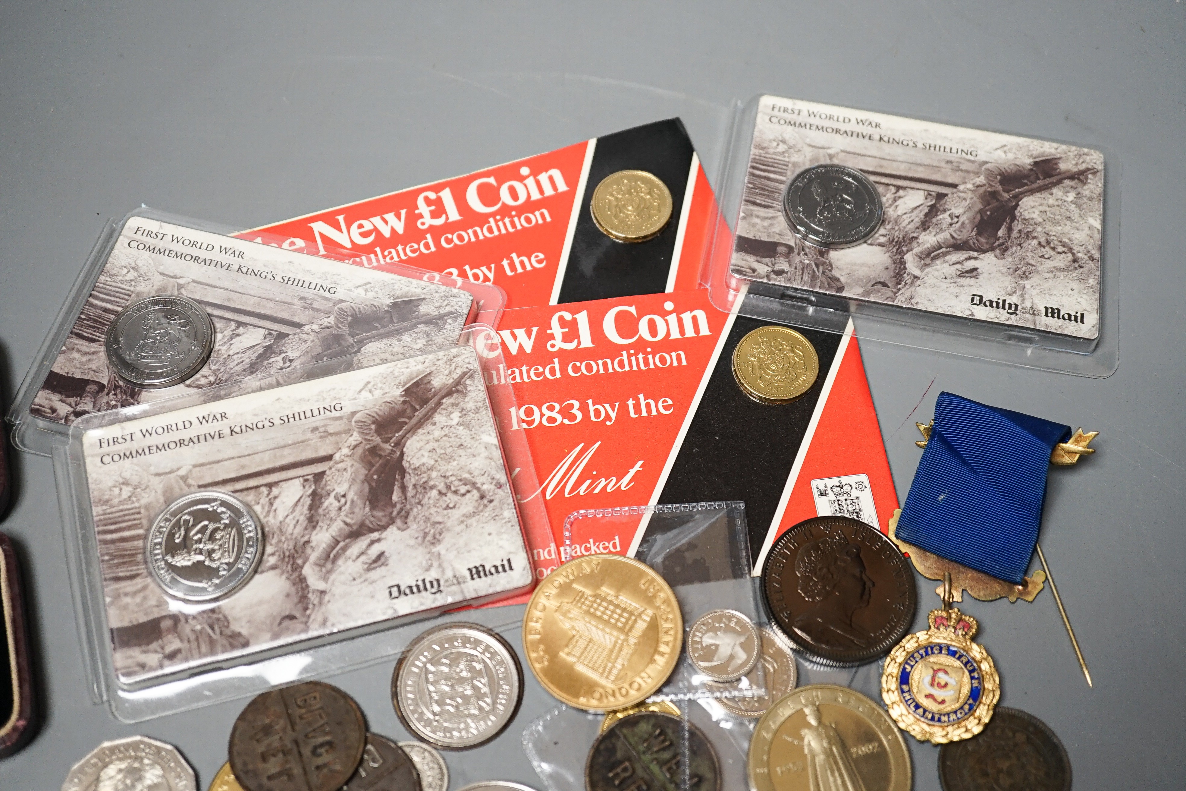 A collection of military badges and a collection of coins
